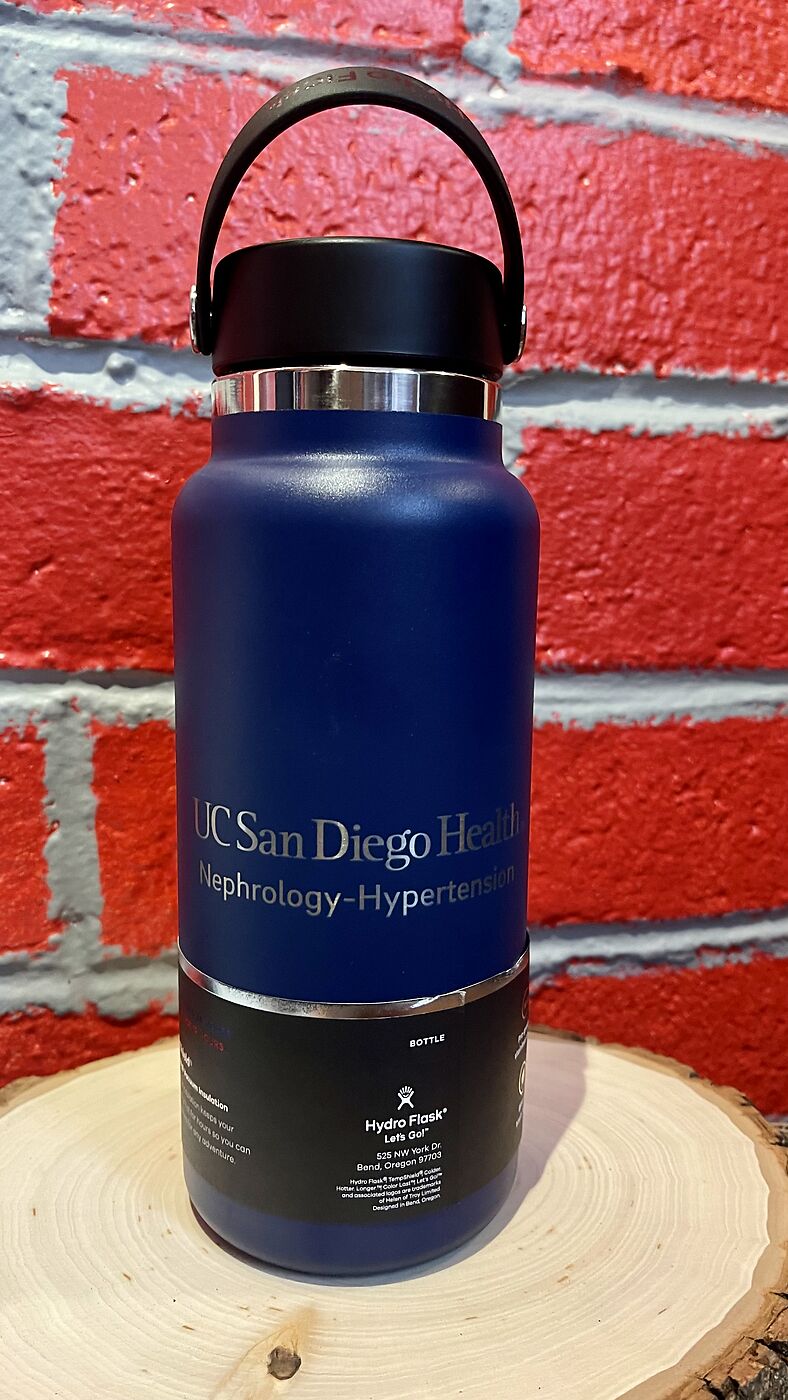 Navy water bottle engraved with a logo