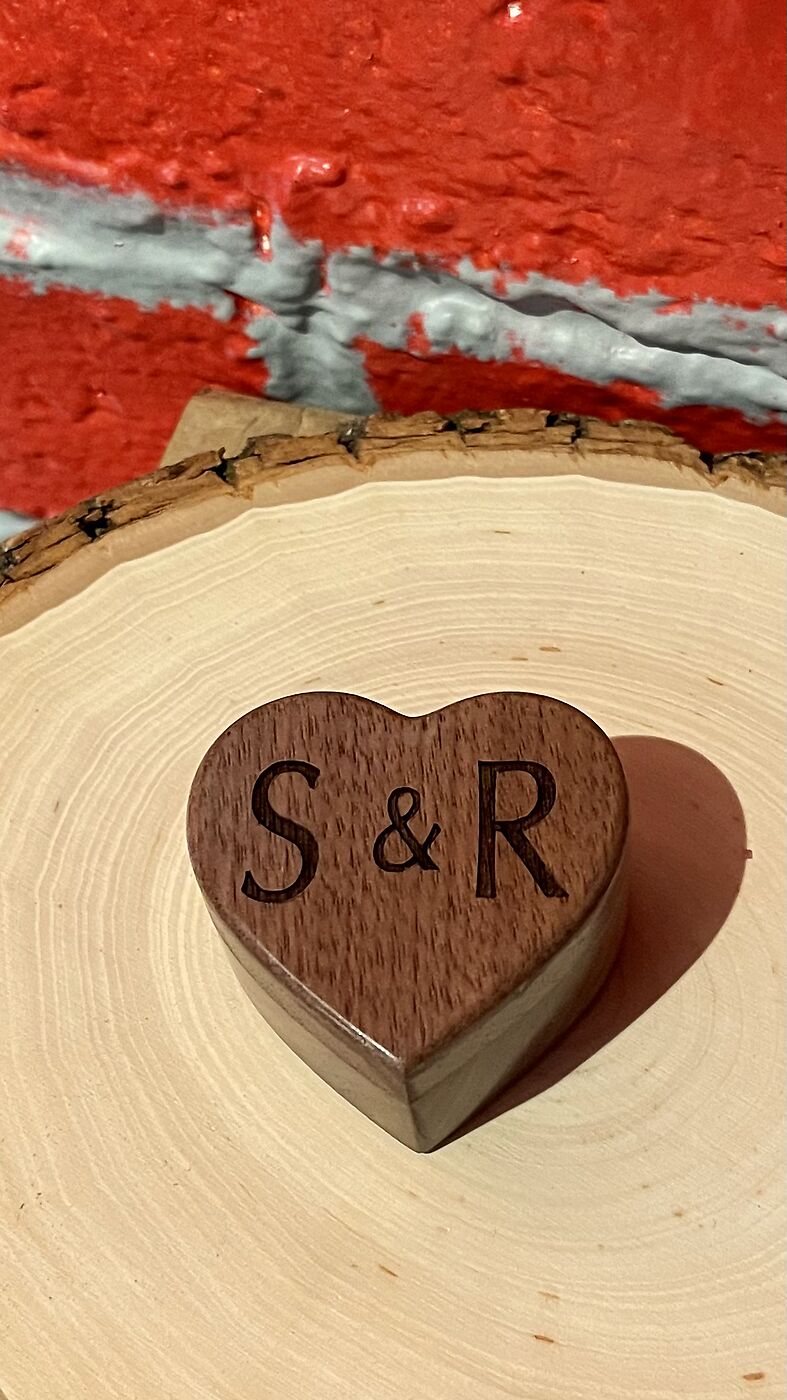 Heart-shaped wooden box engraved with initials